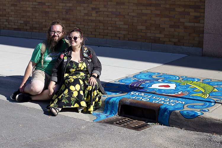 Eddie Lee and Megan Strachan collaborated on the project creating two murals surrounding storm drains in downtown Port Huron.