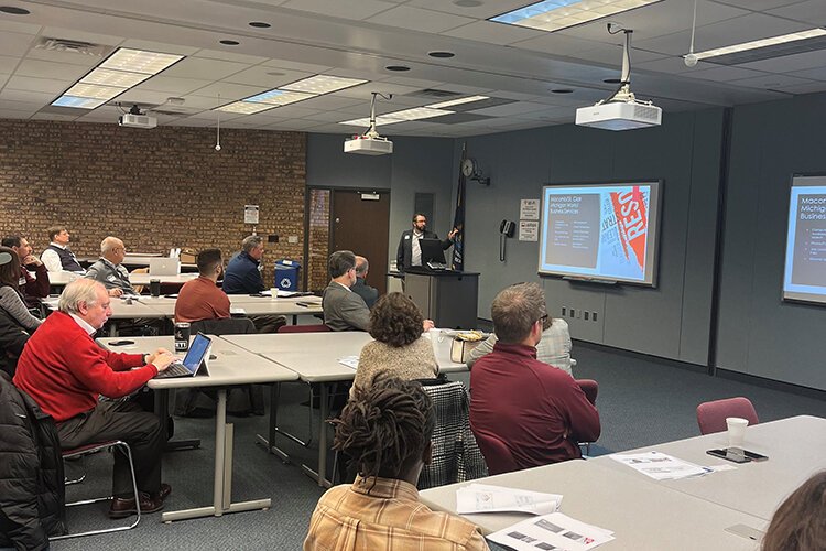 Christopher Reilly, Director of the Macomb/St. Clair Employment and Training Agency speaks at an Eastern Michigan Manufacturing Association meeting about the Going PRO Talent Fund, apprenticeships, and other grants available through Michigan Works!