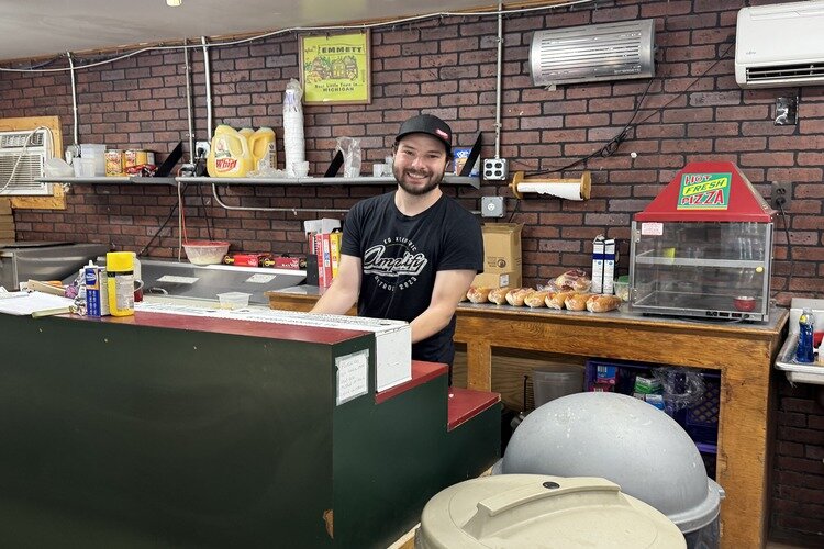 Ethan Trombley making sandwiches at Trombley's Country Market.