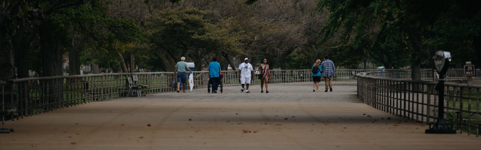 People walk at Lake St. Clair Metropark.