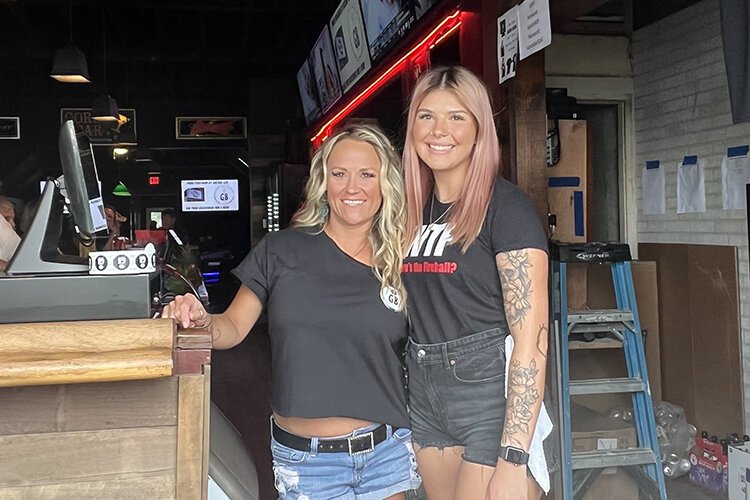 Gord’s staff Shannon Wesley (left) and Libby Ringle pose for a photo at the bar.