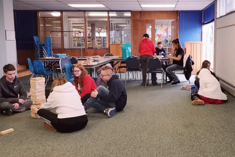 Youth in the Blue Water Homeschool Teens Cooperative get together to play board games at the library.