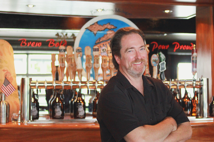 The photo in the pub-type setting is Dennis Doyle, the Founder of ThumbCoast.  The setting is the Tap Room, which is the downstairs area. 