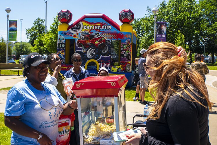 Breanna Henderson-Smith owner of Humble Creations Event Rentals LLC chats with a customer.