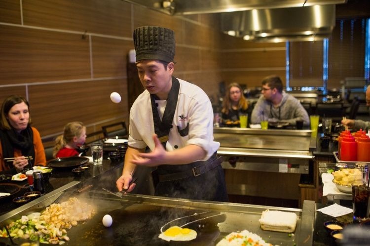 Chefs at Tokyo create a show while making dinner.