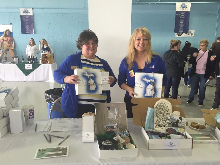 Denise Horvath and Tina Frazier show off a Makers Box featuring locally-made goods.