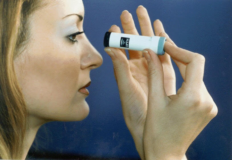 Women look through the vile for a fern-like pattern to determine fertility.