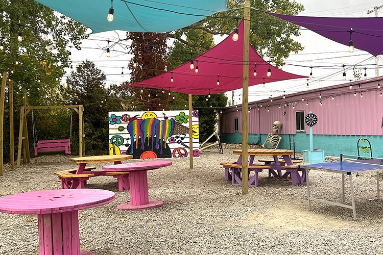 At Hippy Dippy Creamery's outdoor patio, you'll find plenty of seating, games, and artwork by last year's mural contest winner, Stella Collar.