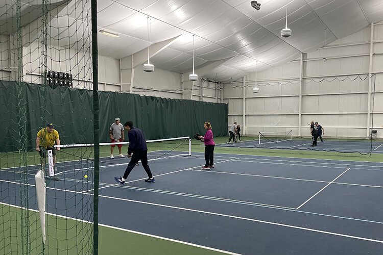 Fort Gratiot resident Mark Smith playing pickleball at the Port Huron Tennis House.