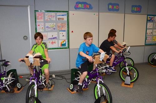 Most students enjoy riding bikes while reading at Avoca Elementary School