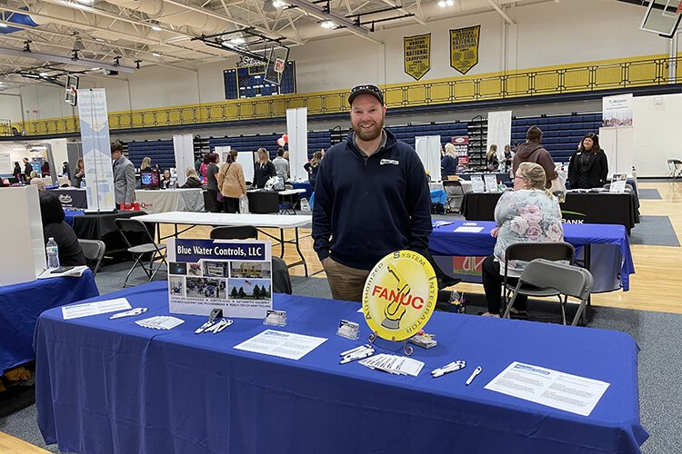 Connor Dann, Project Manager with Blue Water Controls (BWC), at St. Clair County Community College's 2022 Career/Job Fair. Dann was recruited to BWC years earlier through the fair.