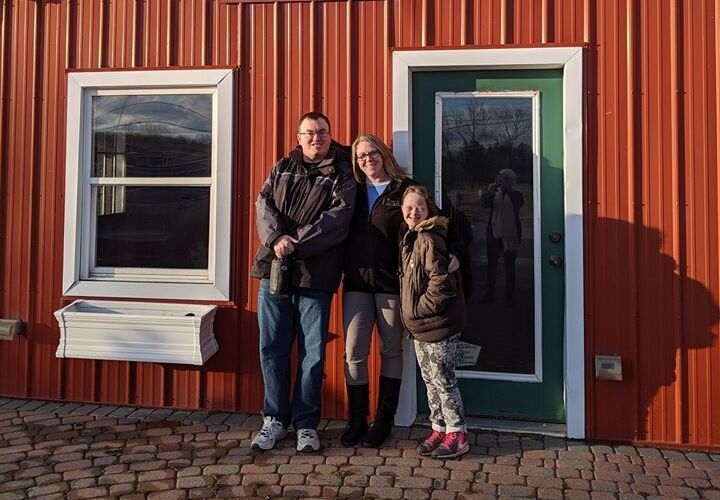 Jennifer Gildenpfennig, center, in front of her new storefront