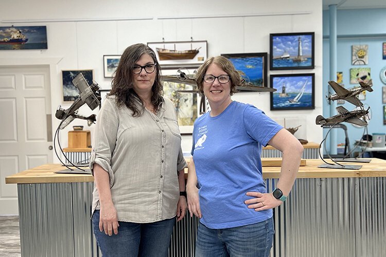 Owner of The Painted Toad Rose Gottler (right) poses for a photo with Jeanne Burris-Johnson, co-founder of New Century Art Gallery.