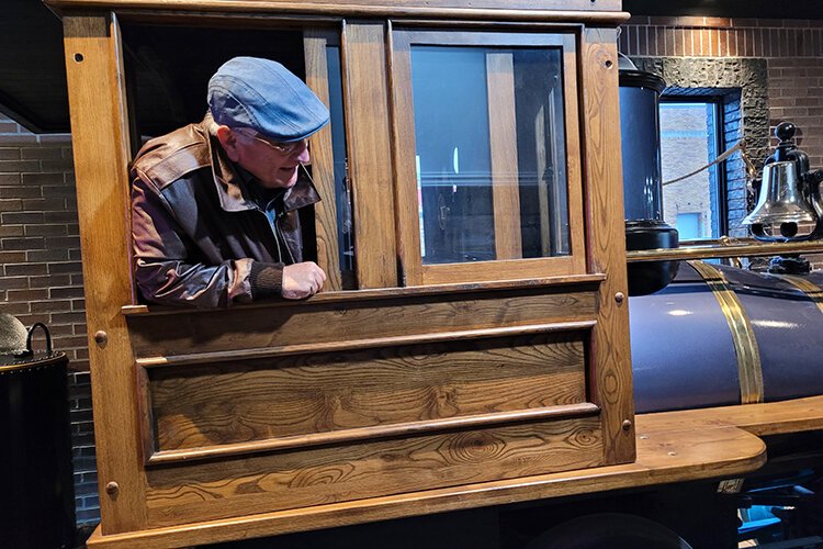 Tom Diehl in the cab of the DB Harrington. Diehl and his brother built the tender tank for the locomotive at his home in Navarre, Ohio in the mid-1980s.