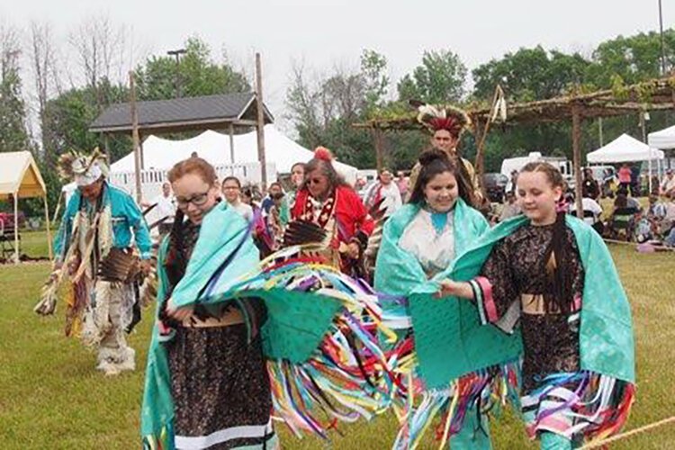 Granddaughters fancy shawl dance at the Saganing pow-wow.