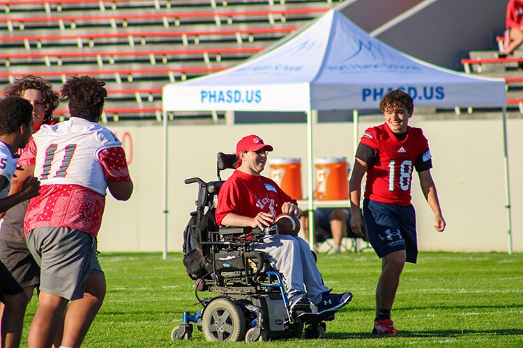 Victory Day participant makes their way to the end zone for a touchdown.