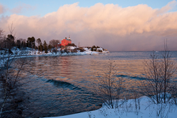 Marquette Lighthouse in winter at dusk