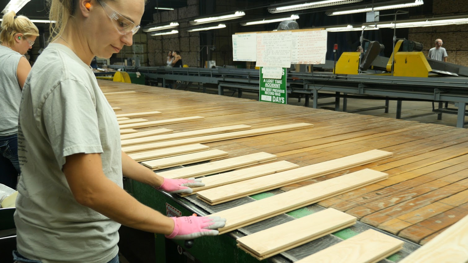 An employee of Connor Sport Court in Amasa is part of the process of crafting hard maple for   the Boston Celtics’ famed parquet floor. (photo courtesy Nick Jensen/Floline Media)