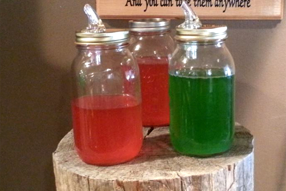 Jars containing Skittle-infused vodka at the Bear's Den Brewpub. 