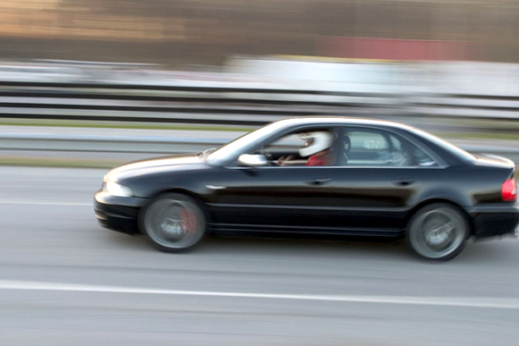 A car races around a test track. 