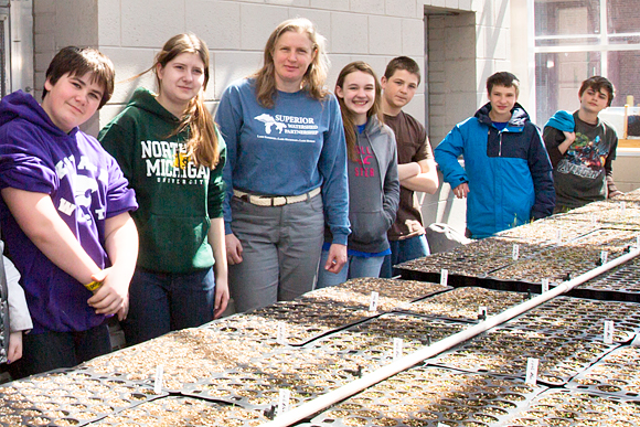 Jenn Hill of Superior Watershed  Partnership and youth at the greenhouse