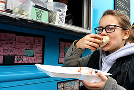 Shaylyn Eggleston grabs a bite to eat at Dia De Los Tacos. 