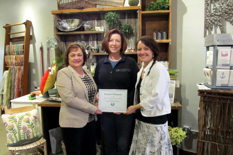 Gathered Earth owner Erica Smith, center, with Marquette DDA representatives.