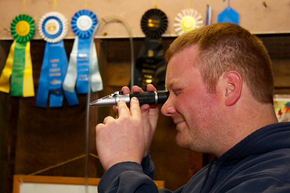 Ben Harris uses a refractometer.