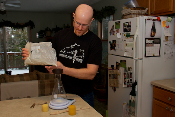 David Gill of Marquette Home Brewers measures ingredients.