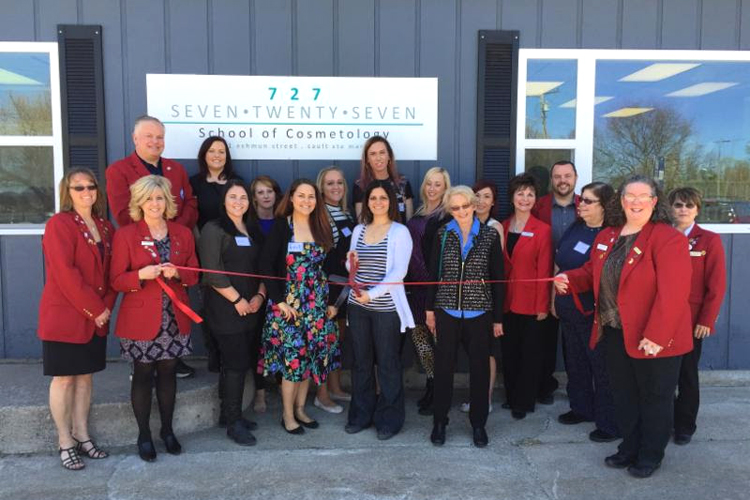 Danielle Eggert cuts the ribbon on her 727 School of Cosmetology.