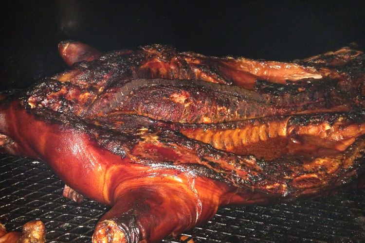 A whole hog being roasted by Slows BarBQ of Detroit.