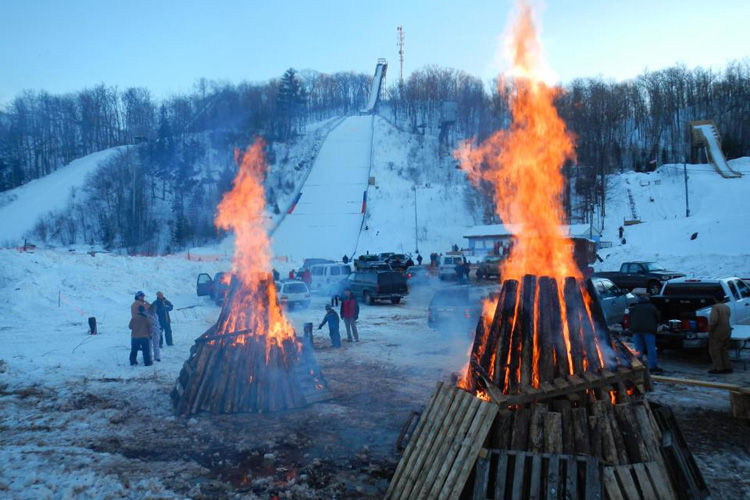 Onlookers prepare for ski jumping at Suicide Hill in Ishpeming.