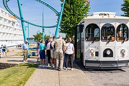 Passengers board a trolley to take a tour of Muskegon.
