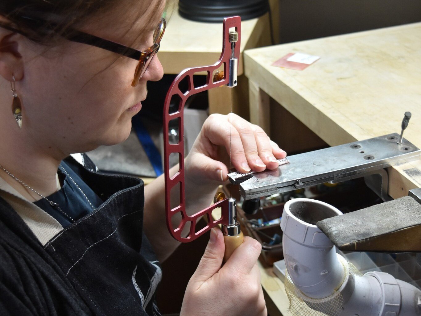 Beth Millner at work in her studio above her retail shop on Washington Street in Marquette.