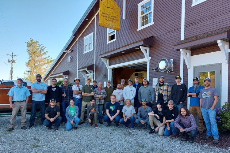 A recent class enrolled at the Great Lakes Boat Building School.