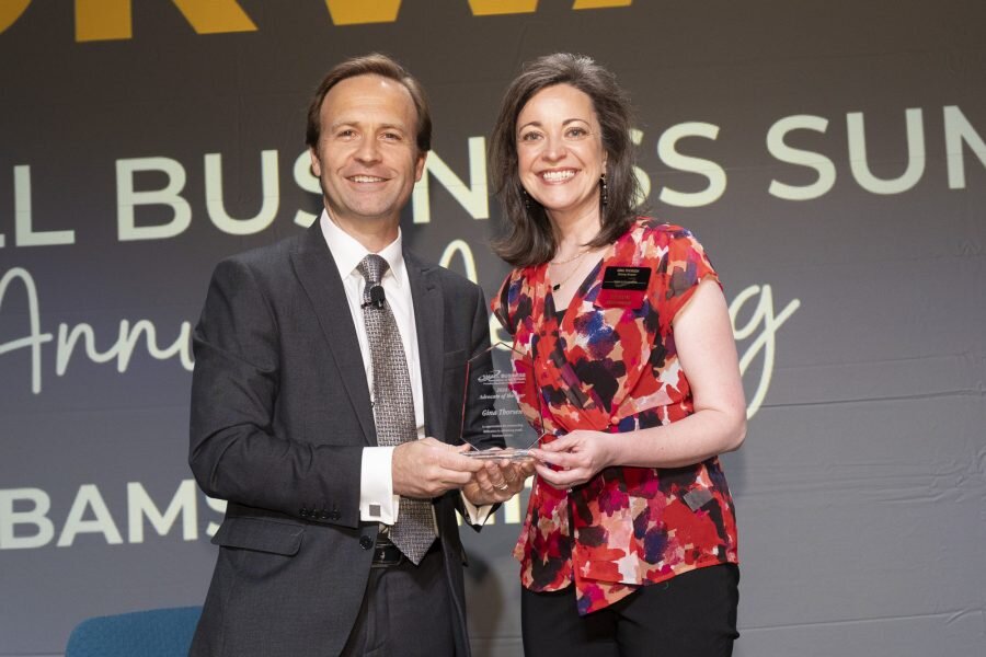 SBAM President and CEO Brian Calley (left) presents the Small Business Association of Michigan 2024 Advocate Award to Stormy Kromer CEO Gina Thorsen at the SBAM annual meeting on June 13 in Lansing.