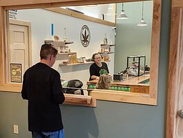 A customer visits the Munising Cannabis Company, which opened its doors in October.