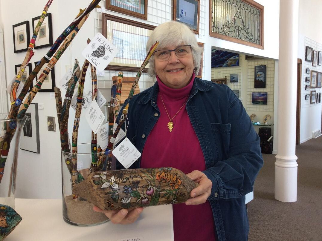 Linda Schroeder Golding, gallery president, shares some of the art on display.