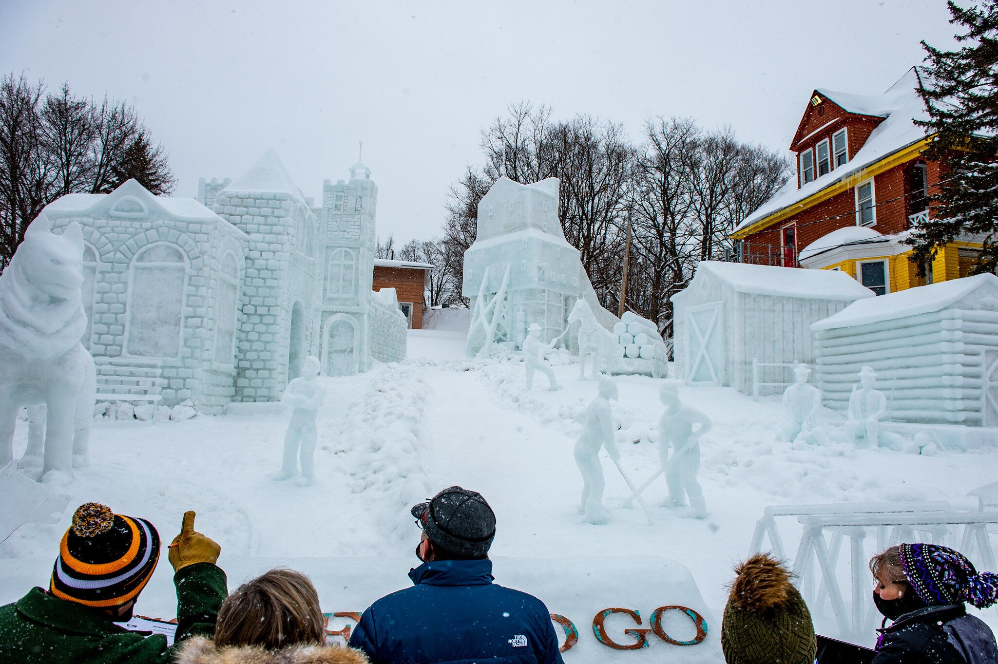 Onlookers appreciate a snowscape honoring the mining history of the Copper Country. 