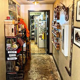 Because the kitchen is so small, the owners had to get creative and make the best use of the hallway.