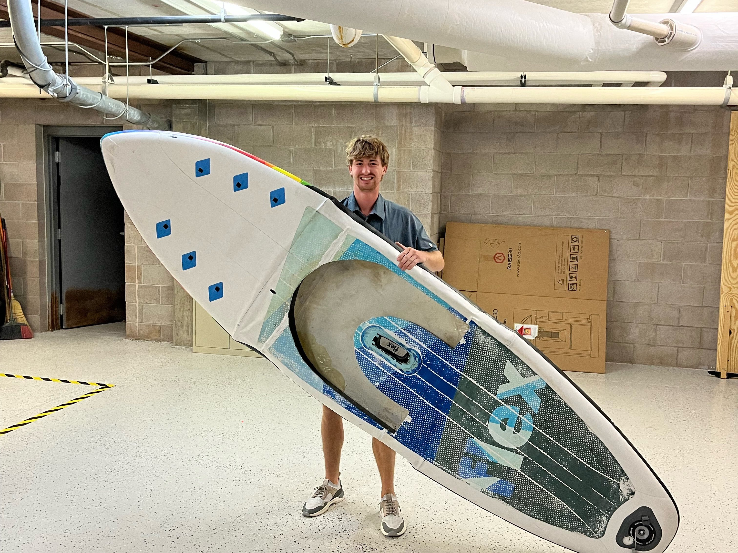 Henry Westlind with his one-of-a-kind paddleboard.