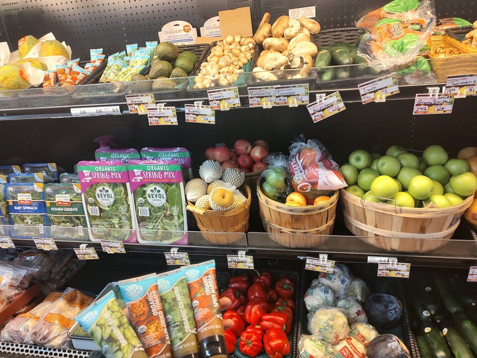 Shelves recently restocked with fresh produce.