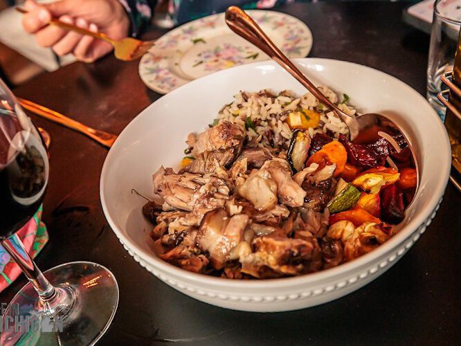 A red wine-braised pork shoulder infused with raisins and citrus, served over a bed of wild rice with local root vegetables.