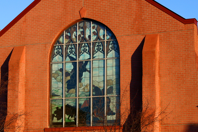 The sun shines on a church in Ishpeming. 