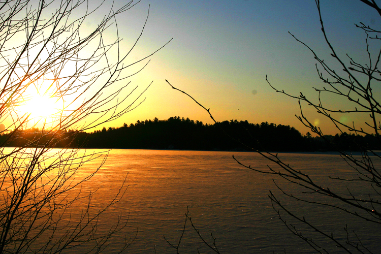 The sun rises over Deer Lake in Marquette County. 