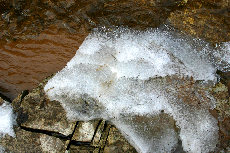 Water and ice mix as spring arrives on the Manistique River. 