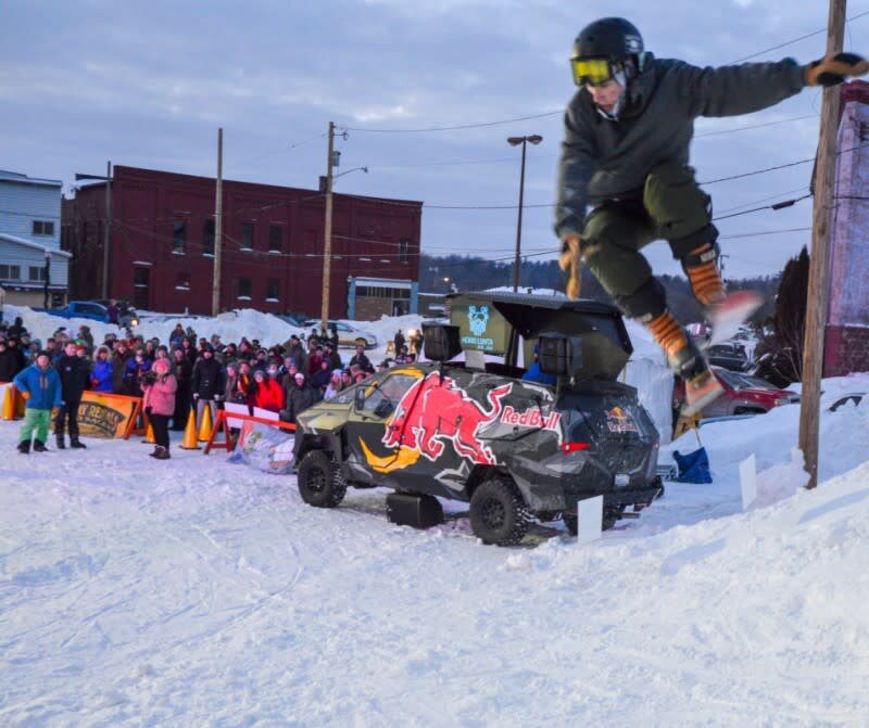 A skier hops on the urban rail jam at the 2022 Heikki Lunta festival in Negaunee. 