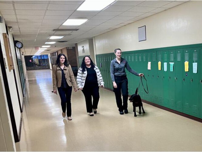 From left to right: Kari Visnaw, superintendent of St. Ignace Area Schools; Nichole Martin, Lasalle High School principal; K9 Team handler Jessica Myjak with Nova.